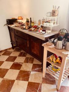 a kitchen with a counter with food on it at Casa Mona Turismo de Interior in Llubí