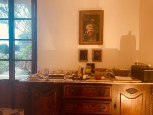 a room with a wooden dresser and a window at Casa Mona Turismo de Interior in Llubí