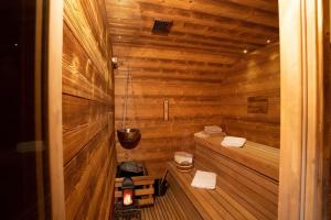 a small wooden sauna with two towels in it at Residence Moritz in Mozirje