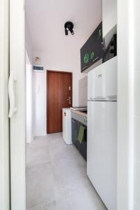 Kuchyňa alebo kuchynka v ubytovaní Hello Apartments Chłopska