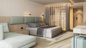 um quarto com uma cama e um sofá em GRIFID Noa - Premium Ultra All Inclusive em Golden Sands
