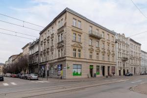a large building on the side of a street at Studio Apartment with Mezzanine near Kraków City Centre by Renters in Krakow