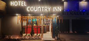 a hotel with a sign that reads country inn at HOTEL COUNTRY INN in Dimāpur