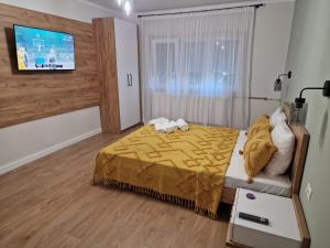 Postel nebo postele na pokoji v ubytování Apartament Alena Oradea + 7 fotografií