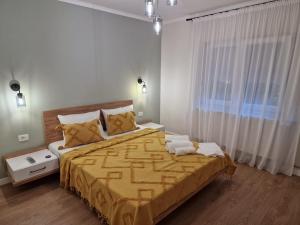 Postel nebo postele na pokoji v ubytování Apartament Alena Oradea