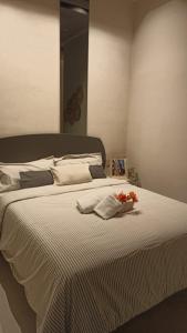 a bedroom with a large bed with flowers on it at ARTURO SORIA Apartamento de LUJO a estrenar in Madrid