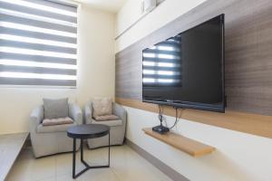 TV a/nebo společenská místnost v ubytování Jialai Homestay