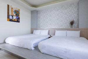 Postel nebo postele na pokoji v ubytování Jialai Homestay