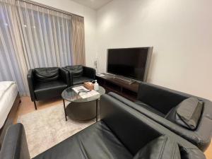 TV a/nebo společenská místnost v ubytování SALON Shibuya