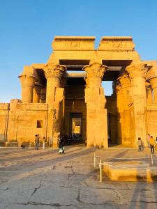 a group of people standing in front of a building at Pyramids Paradise View Inn Hotel in Cairo