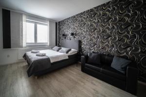 Rúm í herbergi á Garni hotel Svitavy