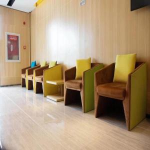 a row of chairs in a waiting room at IU Hotels Beijing Changping Bei Qijia in Changping