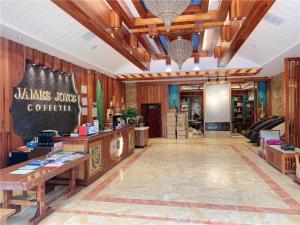 a lobby of a store with wooden walls at James Joyce Coffetel Xishuangbanna Gaozhuang Starlight Night Market in Jinghong