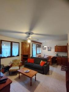 a living room with a couch and a table at Zen House in Domaso
