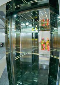 a glass display case in a building with chinese decorations at Hong Ha Hotel in Pleiku Airport