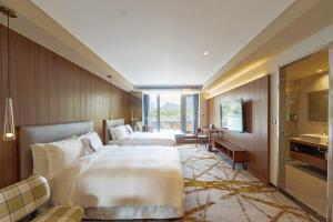 Katil atau katil-katil dalam bilik di Home Hotel
