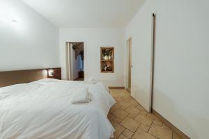 Postel nebo postele na pokoji v ubytování Hotel Alla Sosta