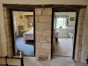 an open doorway into a room with a bedroom at Prebendal Manor in Nassington