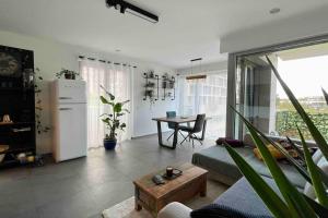 a living room with a couch and a table at Beautiful High Standard Apartment in Luxembourg