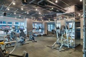 a gym with several treadmills and machines in a room at Blueground Fenway gym nr food shops BOS-1027 in Boston