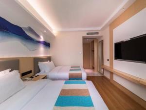 Ліжко або ліжка в номері VX Hotel Xiamen Siming District Xiamen University Huandao Road