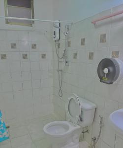 a bathroom with a toilet and a shower in it at Cozy Home With Lake View at Kathu PHUKET in Ban Huai Luk (1)