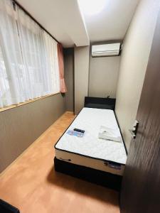 Krevet ili kreveti u jedinici u objektu Lei Okinawa Hostel Womens only