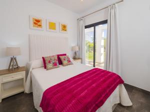 a bedroom with a large bed and a window at Cubo's Casa Rural El Oasis De Don Pedro in Villafranco de Guadalhorce +60 photos