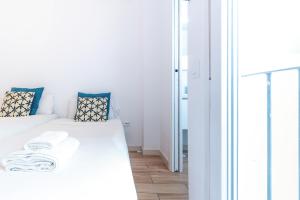 Posteľ alebo postele v izbe v ubytovaní Alohamundi Alameda III