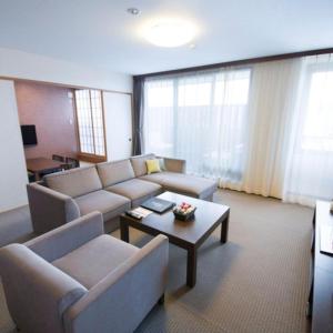 a living room with a couch and a coffee table at Ise Shinsen in Funaechō