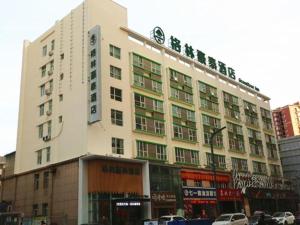a large white building with writing on the side of it at GreenTree Inn Luoyang Railway Station Wangfujing Wangcheng Park in Luoyang