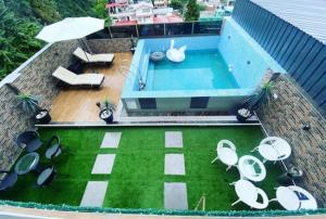 an overhead view of a swimming pool on the roof of a house at Hotel The Relyn Suite Shillong in Shillong