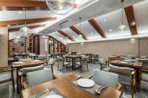 ห้องอาหารหรือที่รับประทานอาหารของ Xiangsu Boang Hotel