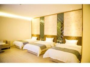 Un pat sau paturi într-o cameră la Super 8 Hotel Xiamen Tong'an Zhonglou