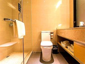 a bathroom with a toilet and a sink and a shower at City Comfort Inn Qingyuan Longtang Light Rail Changlong in Qingyuan