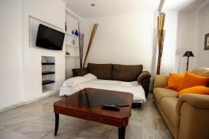 A television and/or entertainment centre at Apartamento amplio y luminoso a 2 min del Centro