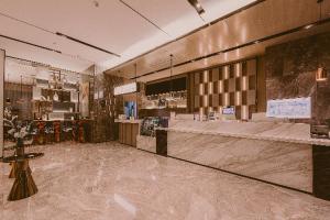 Area lobi atau resepsionis di Echarm Hotel Wuhan Jiefang Park