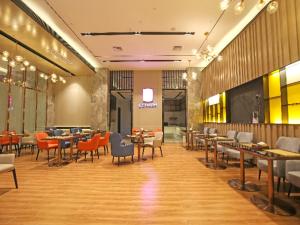 En restaurang eller annat matställe på Echarm Hotel Chengxin Commercial Plaza