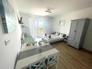 Postel nebo postele na pokoji v ubytování Club218 Holiday Apartman Siófok