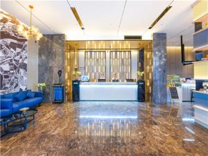 Lobby alebo recepcia v ubytovaní Echarm Hotel Suzhou Shengze Oriental Extile City