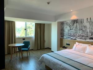 Posteľ alebo postele v izbe v ubytovaní City Comfort Inn Yunfu Bus Station Yihua International Plaza