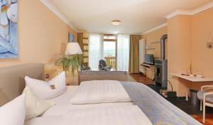 Postel nebo postele na pokoji v ubytování Hotel Sonnentau