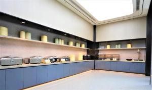 Кухня или мини-кухня в Ji Hotel Shenyang Hunnan Municipal Government
