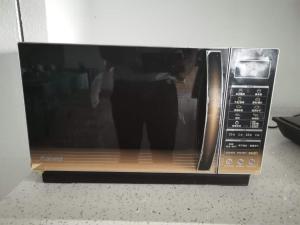 En TV eller et underholdningssystem på Hanting Hotel Jinan High-tech Zone Wanda Plaza