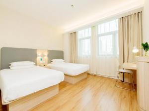 Katil atau katil-katil dalam bilik di Hanting Hotel Ulanhot Railway Station
