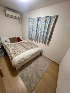 CROWN 越中島 tesisinde bir odada yatak veya yataklar