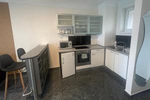 Kuchyň nebo kuchyňský kout v ubytování Club218 Holiday Apartman Siófok