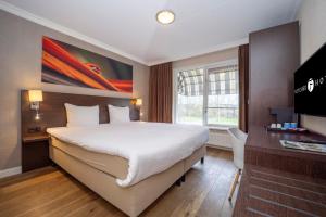 Postel nebo postele na pokoji v ubytování Fletcher Hotel-Restaurant Arneville-Middelburg
