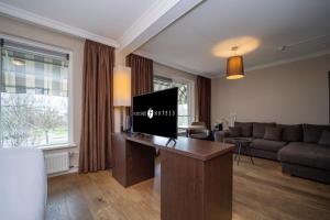 TV a/nebo společenská místnost v ubytování Fletcher Hotel-Restaurant Arneville-Middelburg