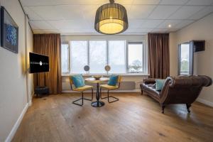 TV a/nebo společenská místnost v ubytování Fletcher Hotel-Restaurant Arneville-Middelburg